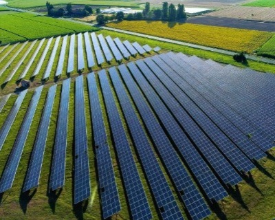 Solar photovoltaic panels generating renewable electricity on farmland